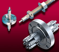 A seven-fiber optic feedthrough on a CF flange, a single fiber optic feedthrough on a CF flange and a bulkhead feedthrough